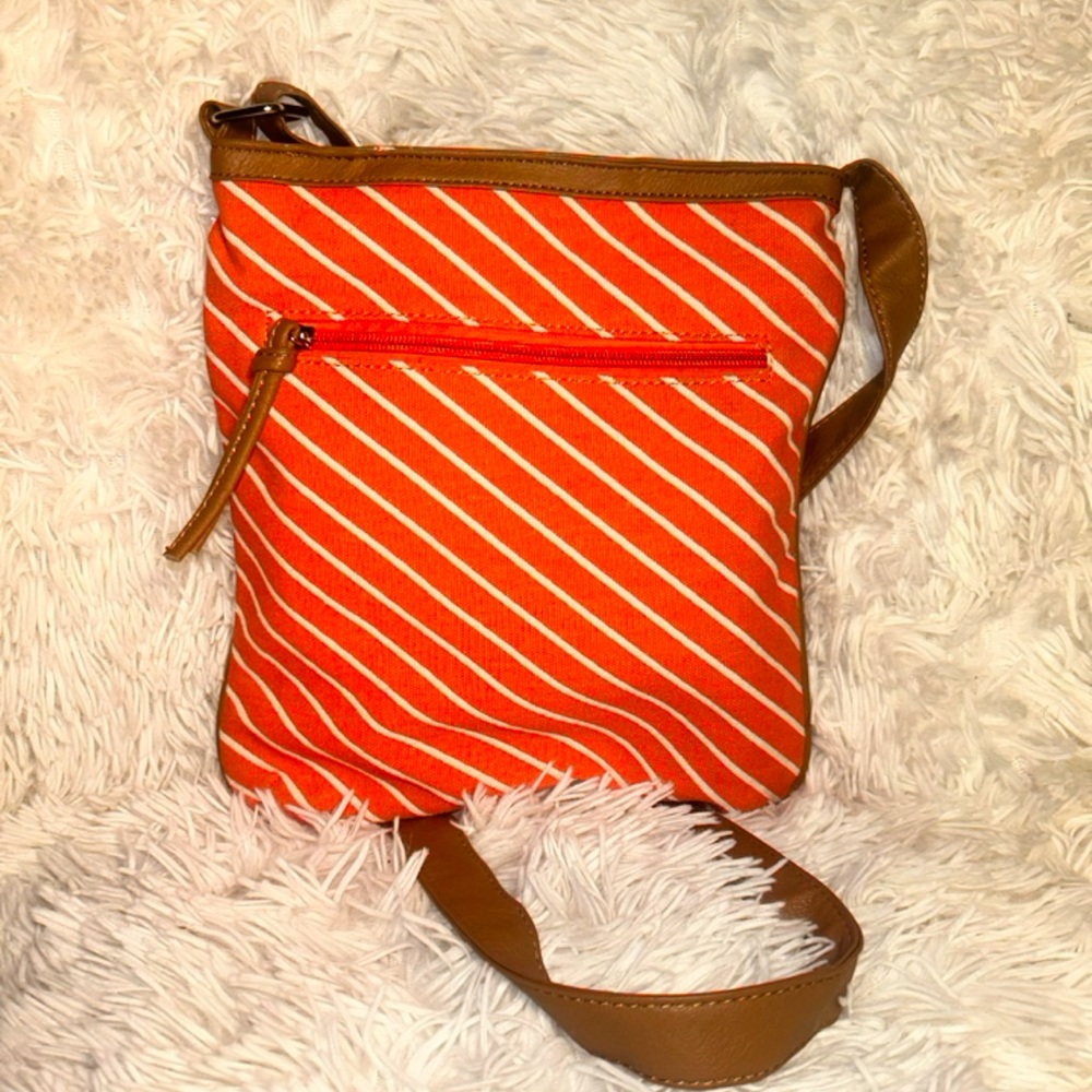 Orange white striped cross body bag with adjustable strap.